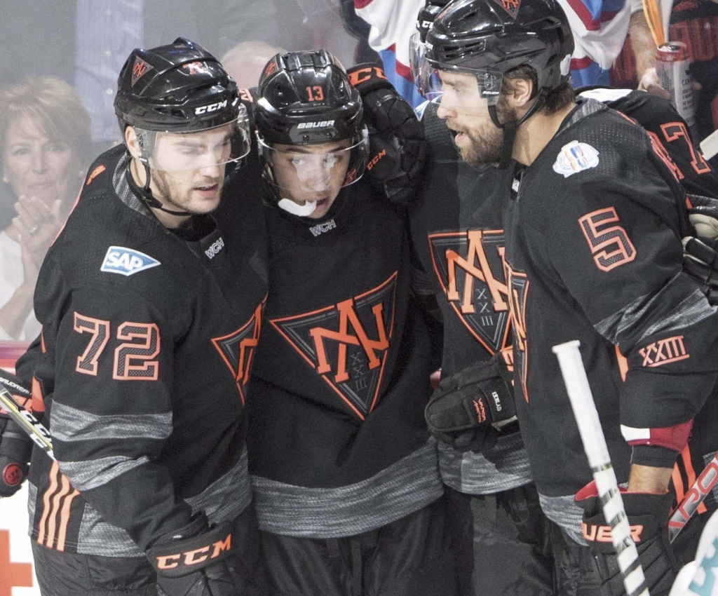 RYAN REMIORZ  THE CANADIAN PRESS Team North America's Johnny Gaudreau celebrates his second goal with teammates Jonathan Drouin and Aaron Ekblad during third period pre-tournament World Cup of Hockey action Sunday in Montreal