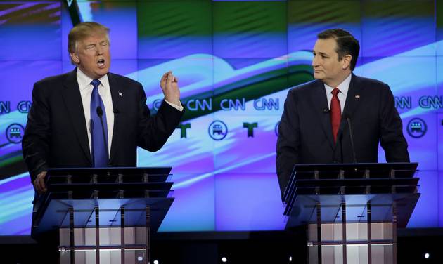 Sen. Ted Cruz R Texas listen as Donald Trump speaks during a Republican presidential primary debate at The University of Houston in Houston. Cruz announced Friday Sept. 23 2016 he will vote for Donald Trump