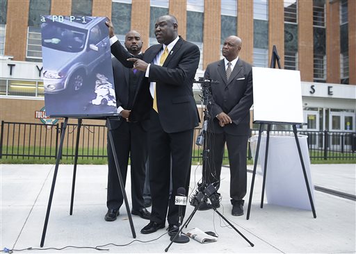 Attorney Benjamin Crump center one of the attorneys for Crutcher's family speaks about Terence Crutcher during a news conference about the shooting death of Crutcher Tuesday Sept. 20 2016 in Tulsa Okla. Crutcher was shot by a Tulsa Police offi