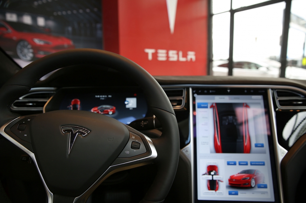 NEW YORK NY- JULY 05 The inside of a Tesla vehicle is viewed as it sits parked in a new Tesla showroom and service center in Red Hook Brooklyn