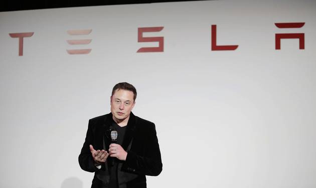 Elon Musk CEO of Tesla Motors Inc. talks during a news conference at the company's headquarters in Fremont Calif. Musk said Sunday Sept. 11 2016 the electric car company is making major improv