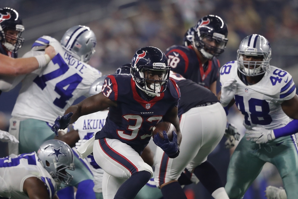 ARLINGTON TX- SEPTEMBER 01 Akeem Hunt #33 of the Houston Texans runs the ball against the Dallas Cowboys during a preseason game at AT&T Stadium