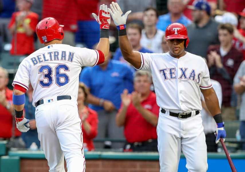 29 AUG 2016 Texas Rangers DH Carlos Beltran is greeted by Adrian Beltre after hitting a home run during the MLB game between the Seattle Mariners and the Texas Rangers at Globe Life Park in Arlington TX