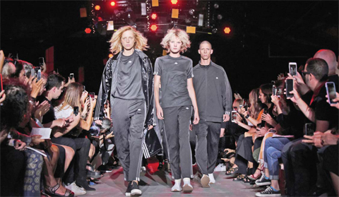 The “Adidas Originals by Alexander Wang” collection is modeled during Fashion Week in New York Saturday. — AP  AFP