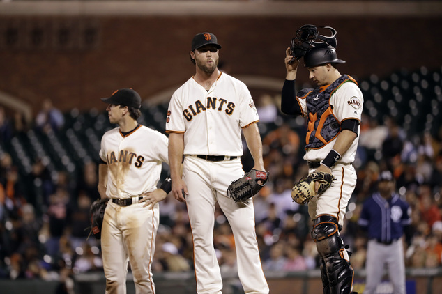 San Francisco Giants relief pitcher Hunter Strickland center waits to be pulled from the game nex to catcher Trevor Brown right during the ninth inning