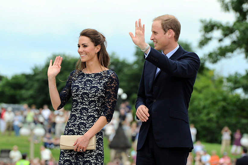 The Duke and the Duchess of Cambridge wave to the crowds as they take part in a ceremony at the National War Memorial in Ottawa on Thursday