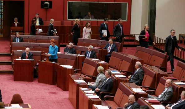 The Greens walk out as Senator Pauline Hanson delivers her first speech in the Senate at Parliament House on Wednesday