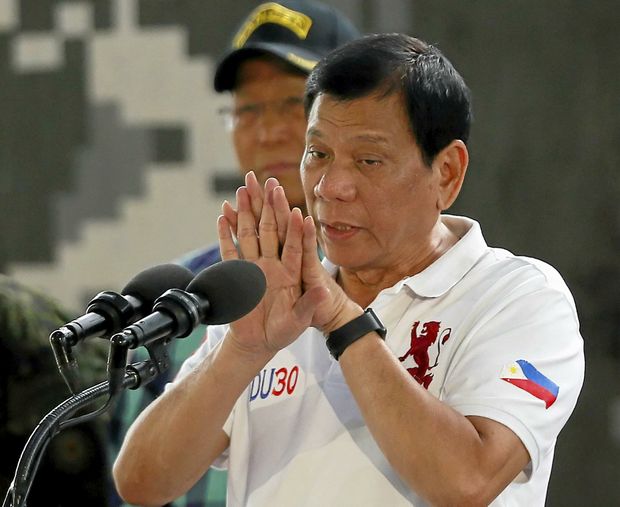 Philippine President Rodrigo Duterte gestures while addressing the Philippine Army Scout Rangers during his visit to their headquarters at Camp Tecson in San Miguel township north of Manila Philippines Thursday Sept. 15 2016. A former Filipino militia