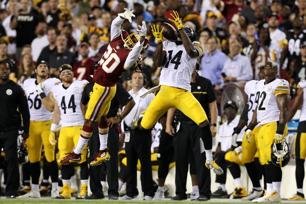 LANDOVER MD- SEPTEMBER 12 Wide receiver Sammie Coates #14 of the Pittsburgh Steelers catches the ball against defensive back Greg Toler #20 of the Washington Redskins in the third quarter at FedExField