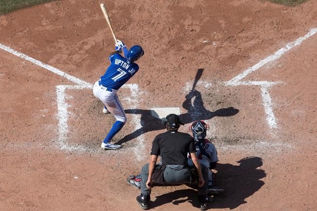 Toronto Blue Jays&#39 Melvin Upton Jr. hits a triple off Minnesota Twins relief pitcher Ryan Pressly before scoring on an error by Minnesota Twins right fielder Max Kepler during eighth inning Major League baseball action in Toronto on Saturday August 2