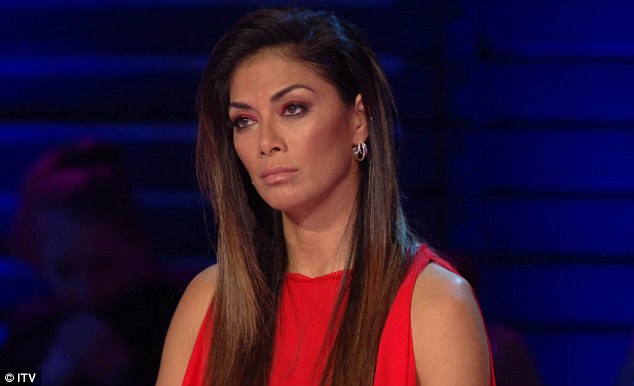 Awkward! Nicole Scherzinger was left red-faced after one of her X Factor acts based his audition on her break-up from Lewis Hamilton during Saturday's episode