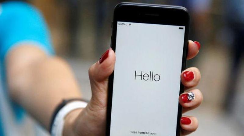 Ayano Tominaga poses with her Apple's new iPhone 7 after purchasing it at the Apple Store at Tokyo's Omotesando shopping district Japan