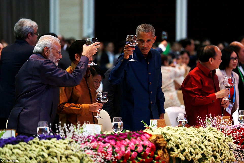 The president shares a toast with India's Prime Minister Narendra Modi at the ASEAN Summit gala dinner in Laos