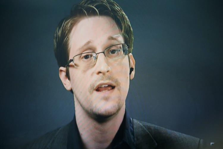 The real Edward Snowden holds a press conference via satellite from Moscow on Wednesday