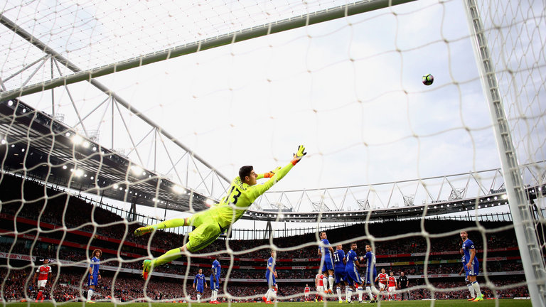 Thibaut Courtois dives to make a save