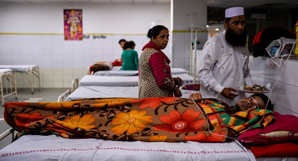 Indian patients lie in the fever ward at the Lok Nayak Hospital in New Delhi