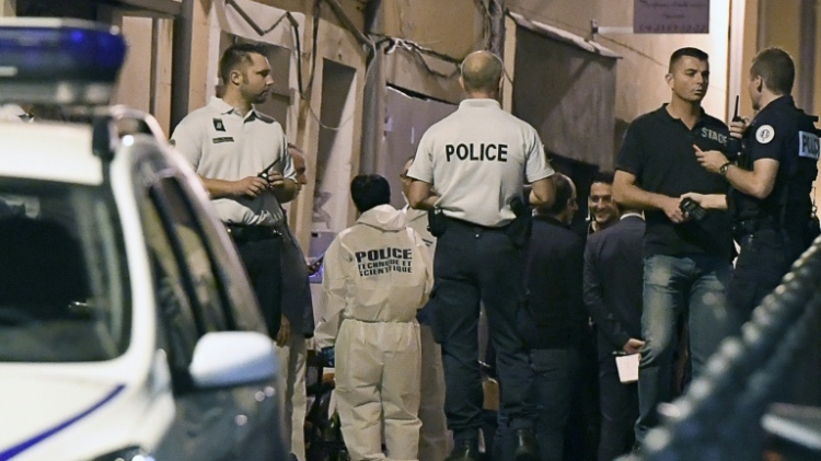 Experts and police outside a bar