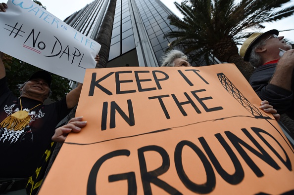 Environmental and Native American rights activists participate in a demonstration against the Dakota Access oil Pipeline in Los Angeles California