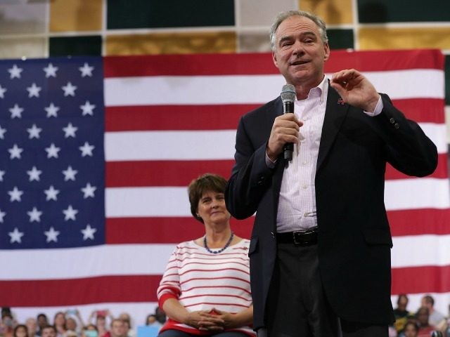 Democratic vice presidential candidate Sen. Tim Kaine  speaks to voters as his wife Anne Holton looks on during a campaign event