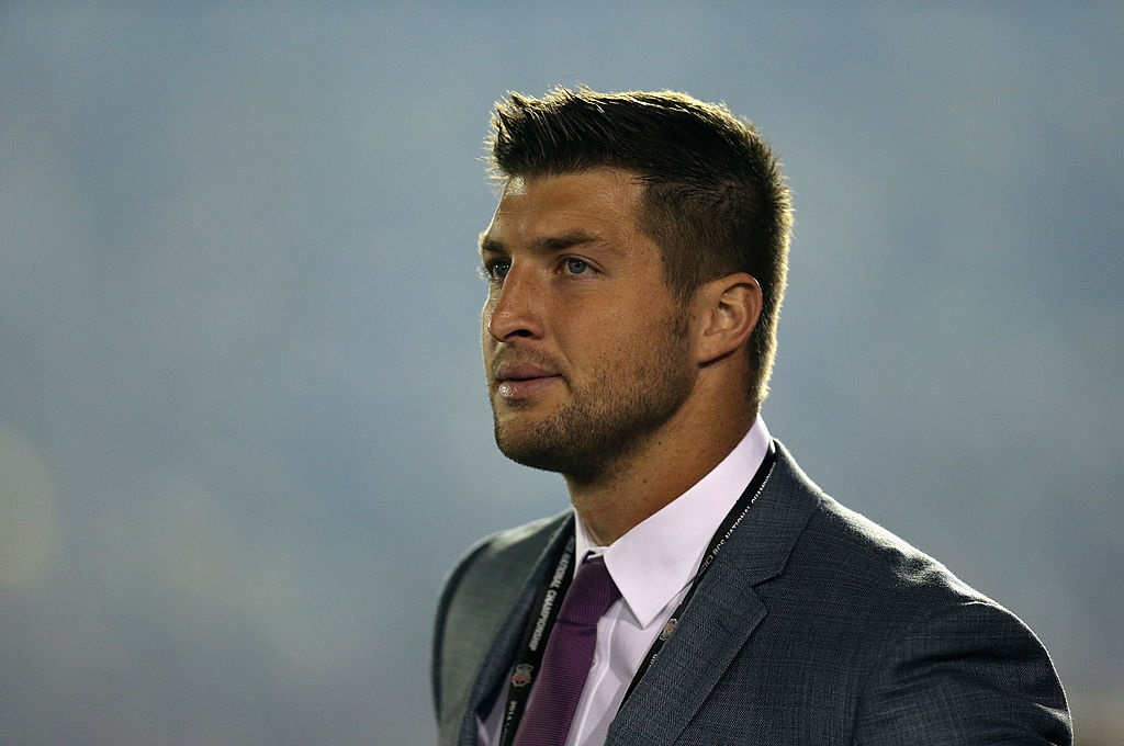 PASADENA CA- JANUARY 06 ESPN analyst Tim Tebow looks on during the 2014 Vizio BCS National Championship Game between the Florida State Seminoles and the Auburn Tigers at the Rose Bowl