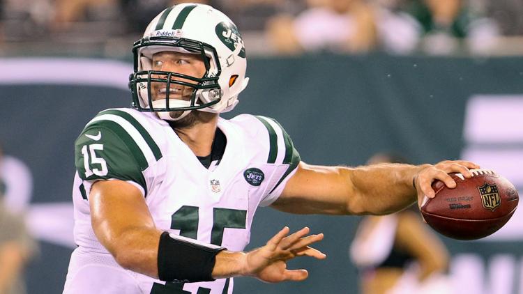 New York Jets quarterback Tim Tebow throws a pass during the second half of their game against the Carolina Panthers at Met Life Stadium