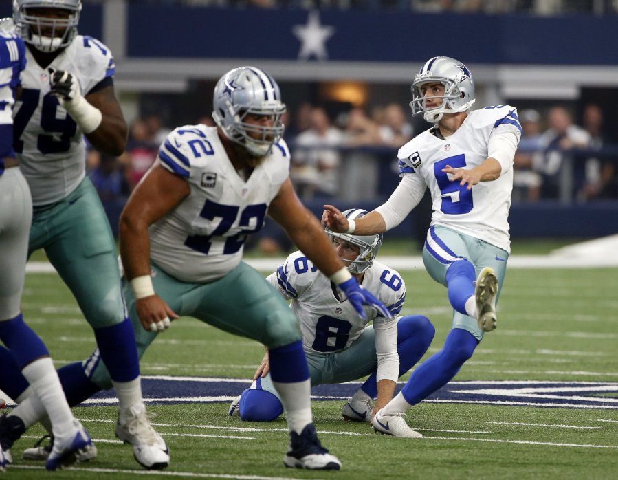 Dallas Cowboys kicker Dan Bailey watches his field goal to through the up rights in the first half of an NFL football game Sunday Sept. 11 2016 in Arlington Texas