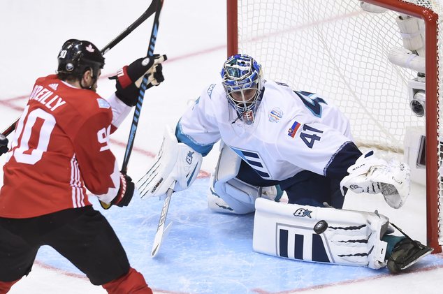 Team Europe goalie Jaroslav Halak makes a save in front of Team Canada's Ryan O'Reilly during the second period of a World Cup of Hockey game in Toronto on W