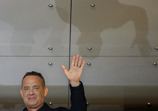 Tom Hanks waves for fans during the Japan premiere