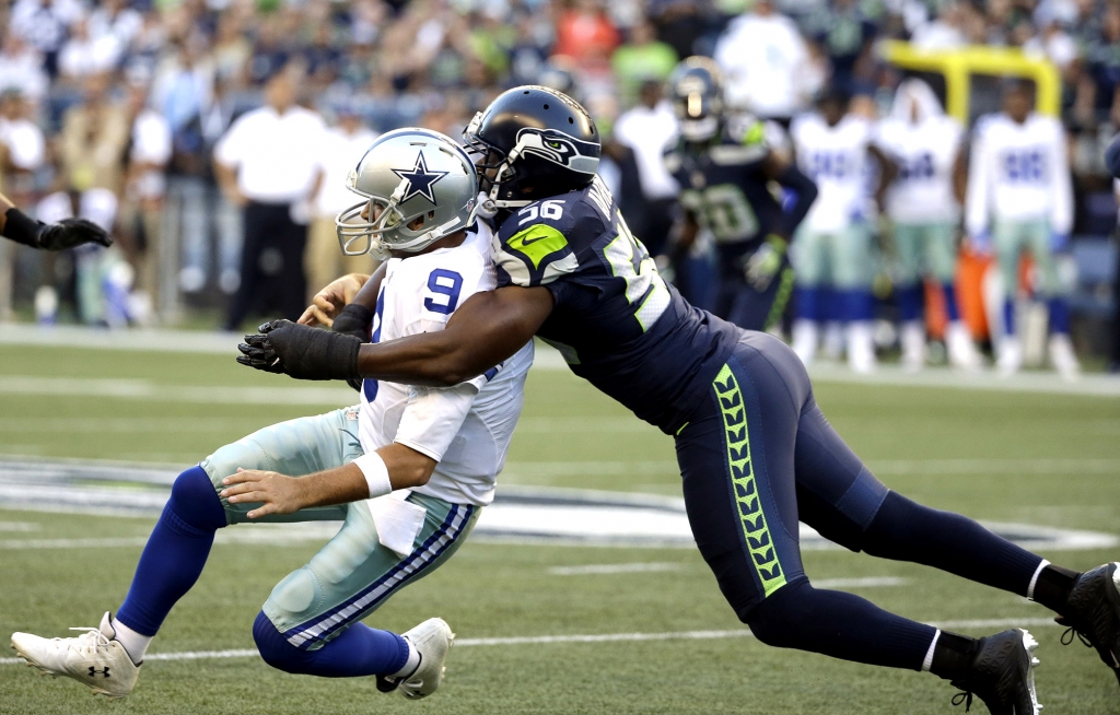 Tony Romo was injured on this hit by the Seahawks’ Cliff