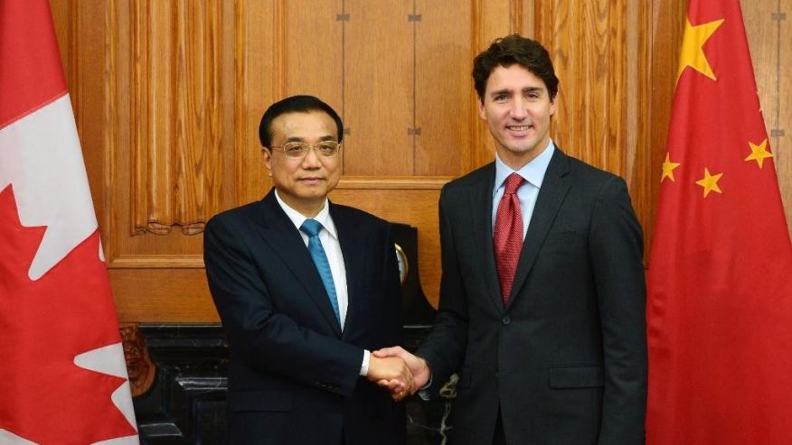 Canadian Prime Minister Justin Trudeau greets Chinese Premier Li Keqiang left as holds an expanded meeting in the Cabinet room on Parliament Hill in Ottawa on Thursday Sept. 22 2016