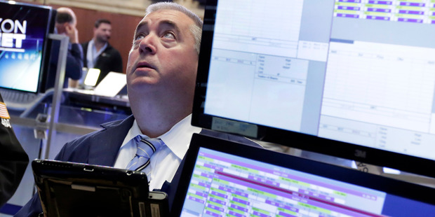 Trader Edward Mc Carthy works on the floor of the New York Stock Exchange