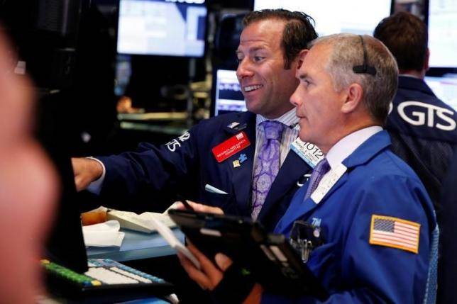 Traders work on the floor of the New York Stock Exchange