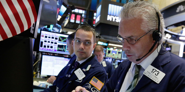 Traders works on the floor of the New York Stock Exchange