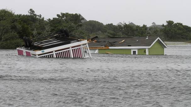 Trailers sit overturned in a creek after Hermine passed through