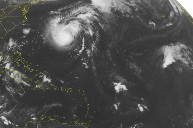 Tropical Storm Karl passes near Bermuda turns north