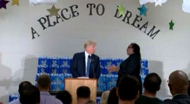 During a visit to a church in Flint Michigan U.S. Republican presidential nominee Donald Trump is chastised by the pastor who said she invited him to the church to'thank us for what we've done in Flint not to make a political speech