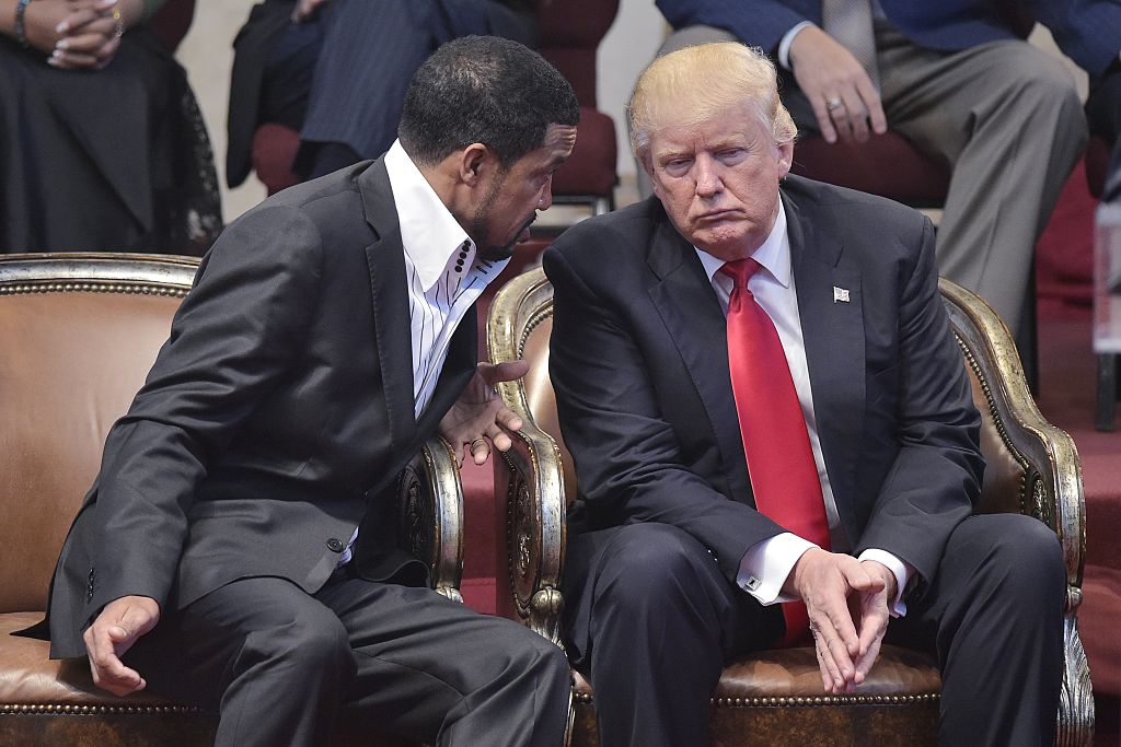 Republican presidential nominee Donald Trump listens to pastor Darrell Scott duing the Midwest Vision and Values Pastors and Leadership Conference at the New Spirit Revival Center in Cleveland Heights Ohio on Sept. 21 2016. (MANDEL NGAN  AFP  Getty Imag