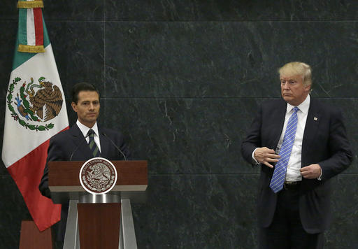 Mexico's President Enrique Pena Nieto and Republican presidential nominee Donald Trump end their joint statement at Los Pinos the presidential official residence in Mexico City Wednesday Aug. 31 2016. Trump is calling his surprise visit to Mexic