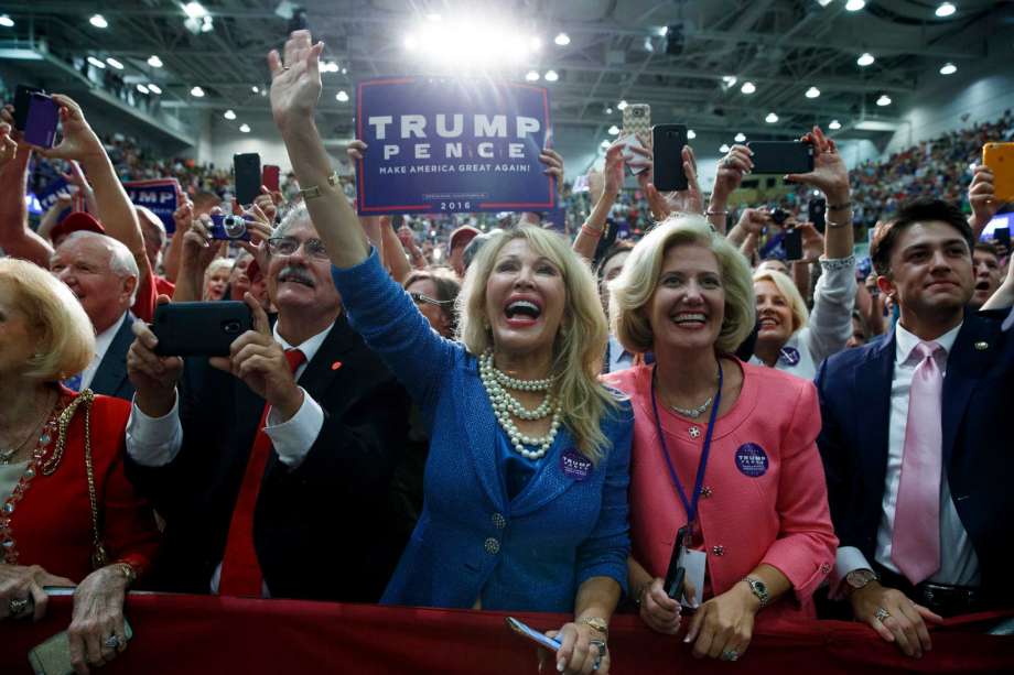 Supporters of Republican presidential candidate Donald Trump cheer as he speaks during a rally Monday Sept. 12 2016 in Asheville N.C