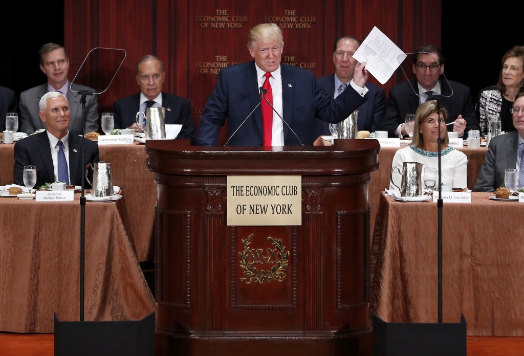 Republican presidential candidate Donald Trump holds up his notes as he speaks at a luncheon for the Economic Club of New York in New York Thursday Sept. 15 2016