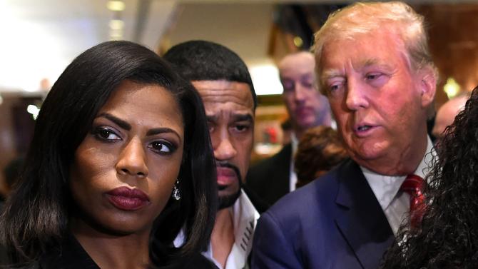 Omarosa Manigault who was a contestant on the first season of Donald Trump’s The Apprentice and is now an ordained minister appears alongside the Republican presidential hopeful during a press conference Nov. 30 2015 that followed Trump's meeti