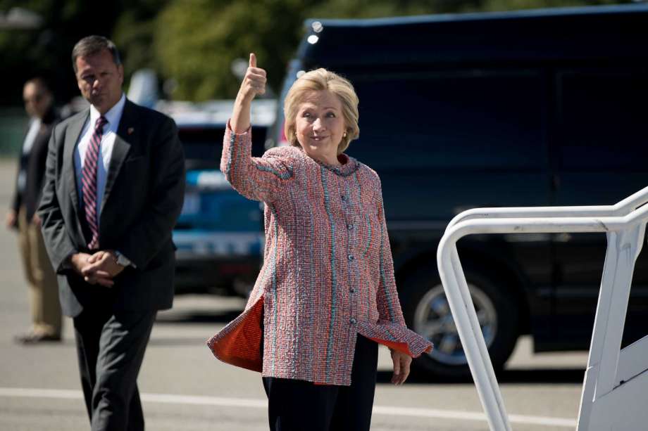 Democratic presidential candidate Hillary Clinton gives a thumbs up as she arrives to board her campaign plane on Thursday. Clinton returned to the campaign trail after a bout of pneumonia that sidelined her for three days and revived questions about both