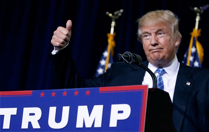 Republican presidential nominee Donald Trump gives a thumbs up to the crowd during a campaign rally