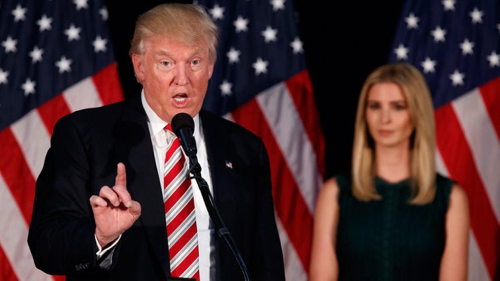 Ivanka Trump right watches as her father Republican presidential candidate Donald Trump delivers a policy speech on child care Tuesday Sept. 13 2016 in Aston Penn