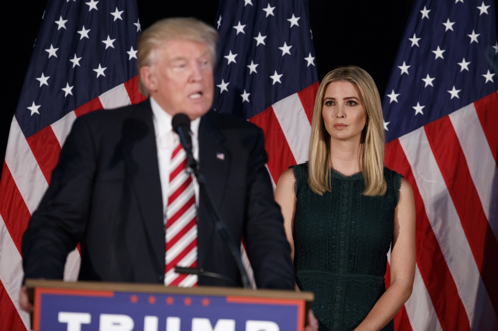 Ivanka Trump right looks on as her father Republican presidential candidate Donald Trump delivers a policy speech on child care Tuesday Sept. 13 2016 in Aston Penn