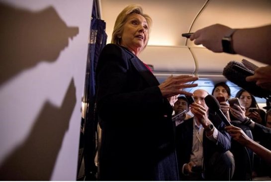 Democratic presidential candidate Hillary Clinton speaks to members of the media on board her campaign plane as she travels to Tampa. When Clinton met up with her brand new campaign plane she greeted crew members climbed