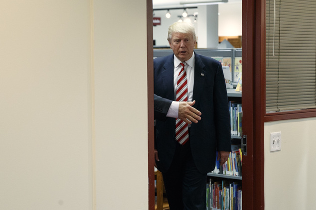 Republican presidential candidate Donald Trump arrives to a round table on child care before delivering a policy speech Tuesday Sept. 13 2016 in Aston P