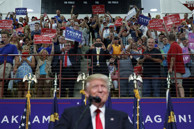 Supporters of Republican presidential candidate Donald Trump cheer as he speaks during a rally Monday Sept. 12 2016 in Asheville N.C