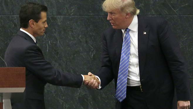 Mexico President Enrique Pena Nieto and Republican presidential nominee Donald Trump shake hands after a joint statement at Los Pinos the presidential official residence in Mexico City Wednesday Aug. 31 2016. Trump is calling his surprise visit to Me