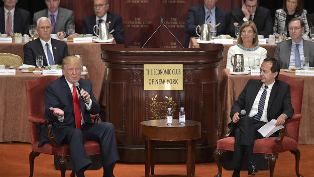 Republican presidential nominee Donald Trump speaks during a chat with financier John Paulson at an event hosted by The Economic Club of New York at the Waldorf Astoria hotel in New York